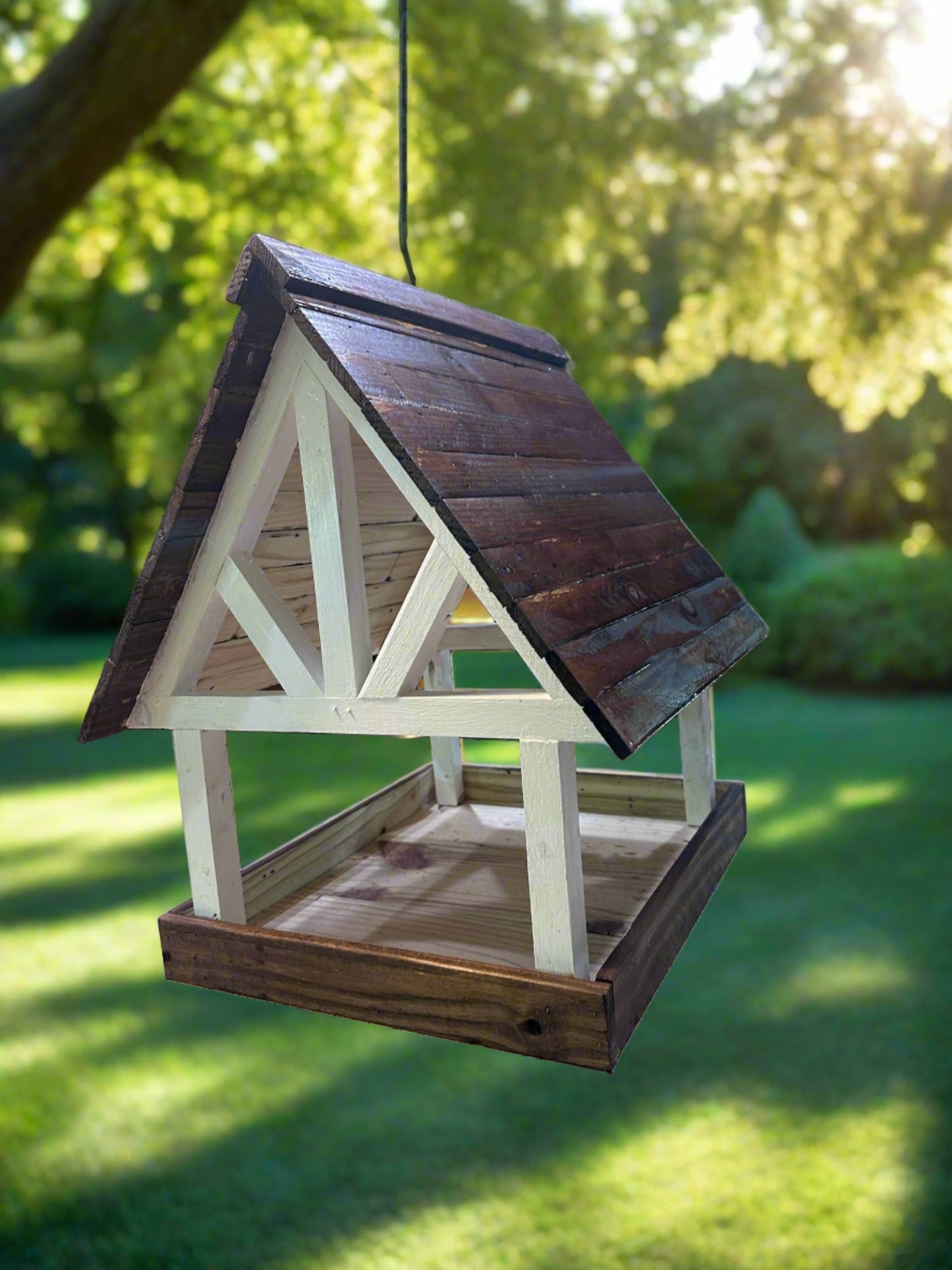  Enjoy attracting birds, squirrels, and other wildlife with this lovely Alpine Deluxe Fly Thru Bird Feeder. Fill up the tray with seed mixes and watch the birds, squirrels, chipmunks, and other wildlife show up to feast! This unique Wildlife Feeder is made with durable pine in a timber-style frame! The eaves extend an inch and a half past the outside edge of the feeder tray, helping to deflect rainwater.