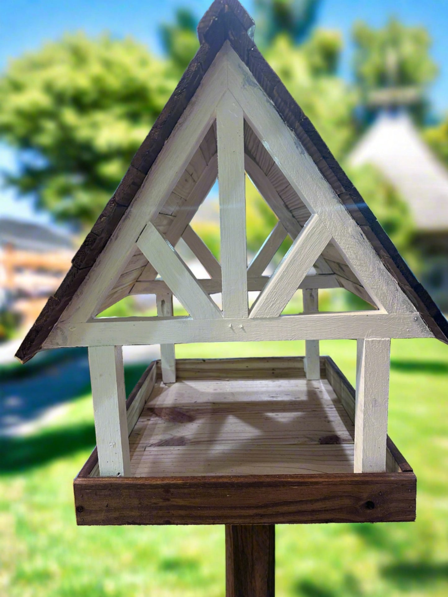  Enjoy attracting birds, squirrels, and other wildlife with this lovely Alpine Deluxe Fly Thru Bird Feeder. Fill up the tray with seed mixes and watch the birds, squirrels, chipmunks, and other wildlife show up to feast! This unique Wildlife Feeder is made with durable pine in a timber-style frame! The eaves extend an inch and a half past the outside edge of the feeder tray, helping to deflect rainwater.