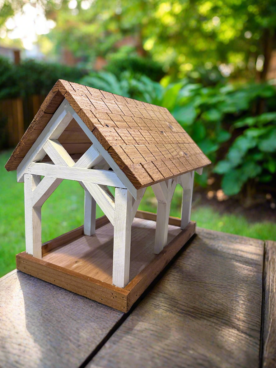 Deluxe Timber Frame Fly Thru Bird Feeder, Columns and Frame stained white with Faux Cedar Shake Rook Stained Honey Teak.