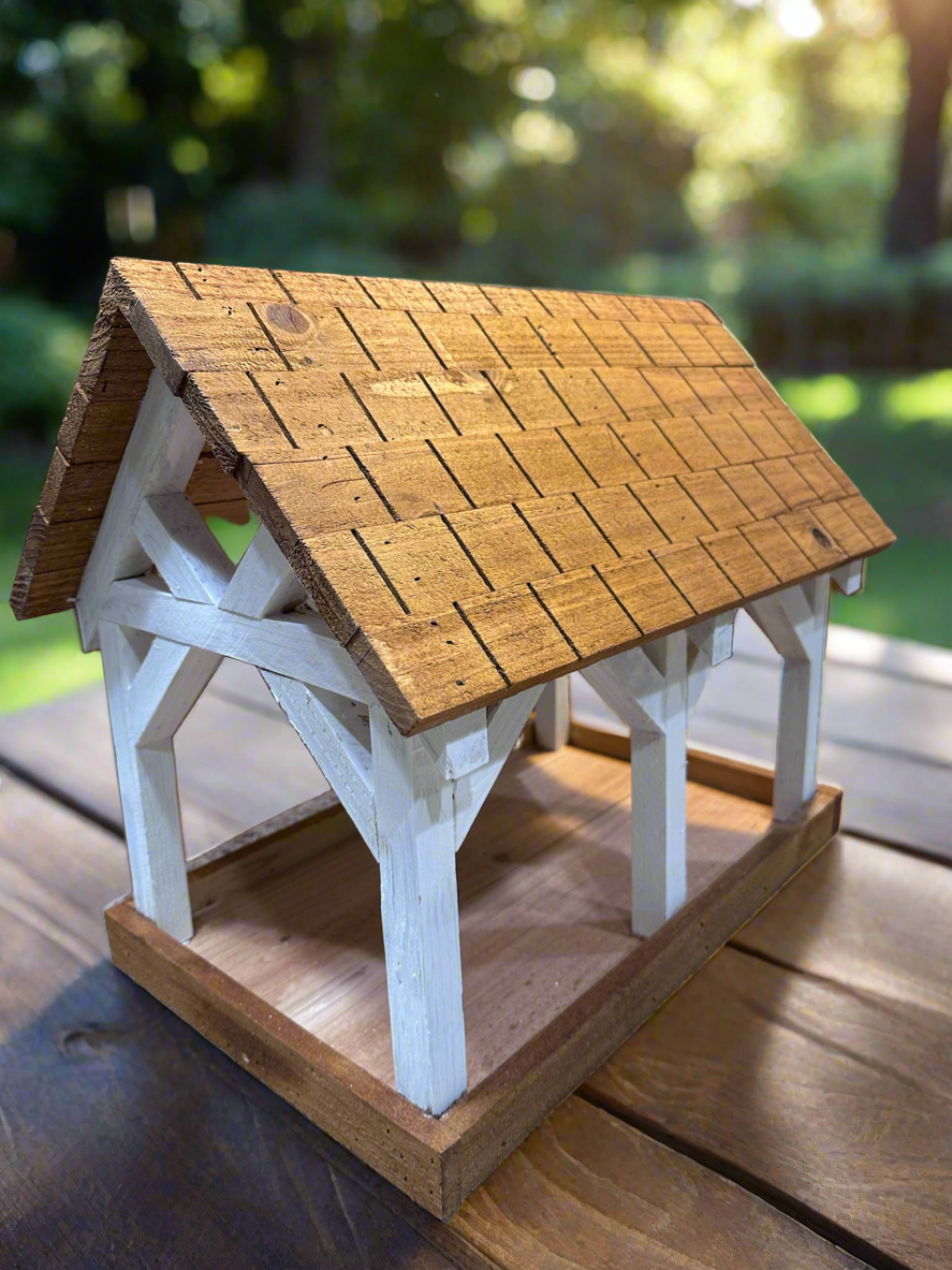 Deluxe Timber Frame Fly Thru Bird Feeder, Columns and Frame stained white with Faux Cedar Shake Rook Stained Honey Teak.