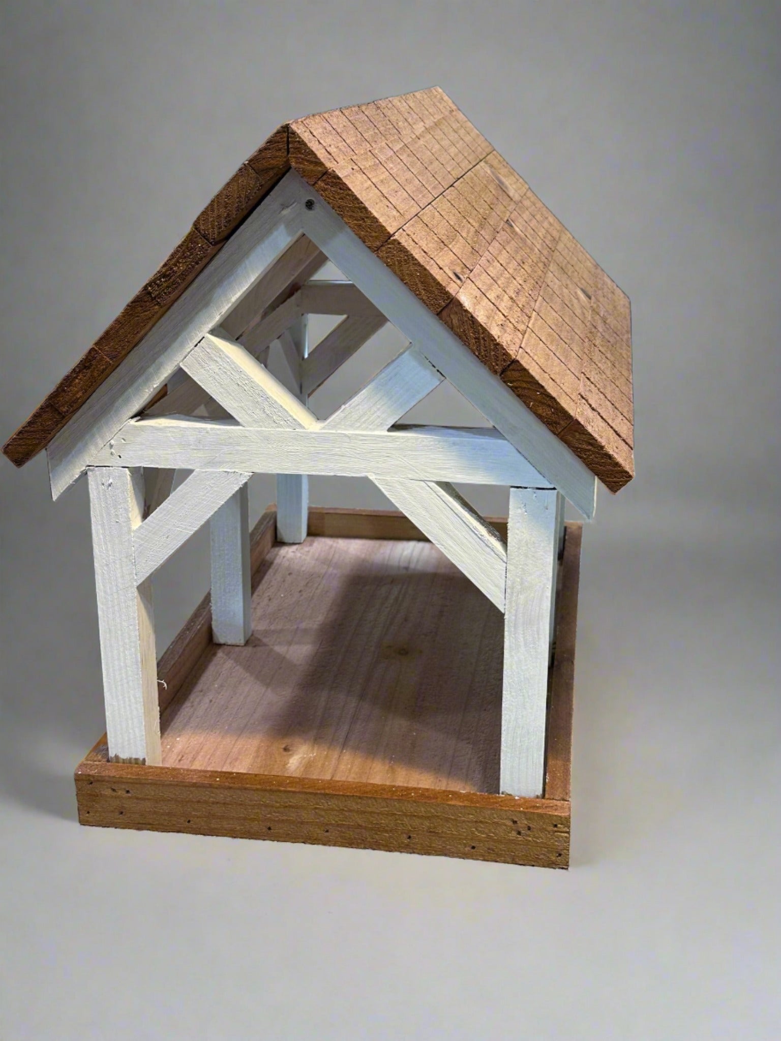 Deluxe Timber Frame Fly Thru Bird Feeder, Columns and Frame stained white with Faux Cedar Shake Rook Stained Honey Teak.