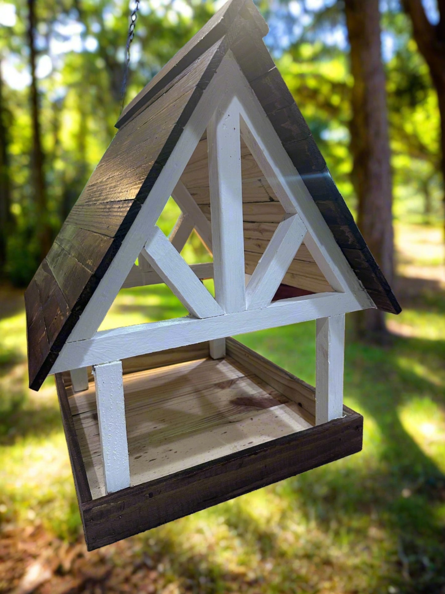 Enjoy attracting birds, squirrels, and other wildlife with this lovely Alpine Deluxe Fly Thru Bird Feeder. Fill up the tray with seed mixes and watch the birds, squirrels, chipmunks, and other wildlife show up to feast! This unique Wildlife Feeder is made with durable pine in a timber-style frame! The eaves extend an inch and a half past the outside edge of the feeder tray, helping to deflect rainwater.