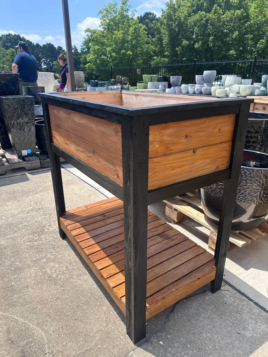 Wooden outdoor table with metal legs on a patio
